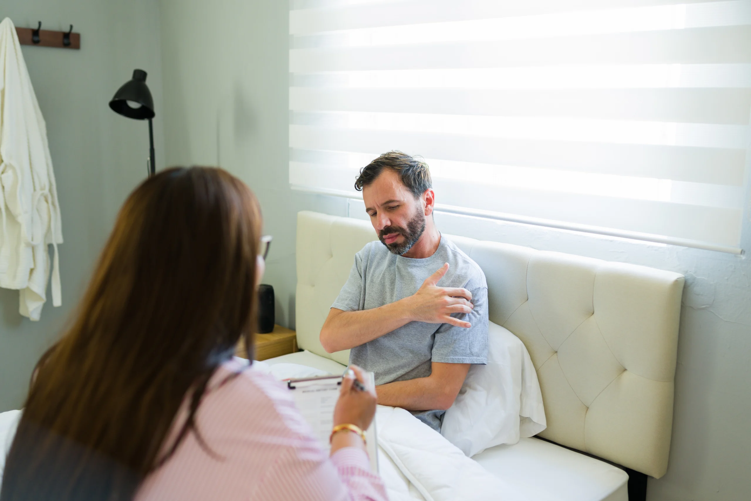 patient recovering from shoulder replacement surgery discussing week by week recovery guide.