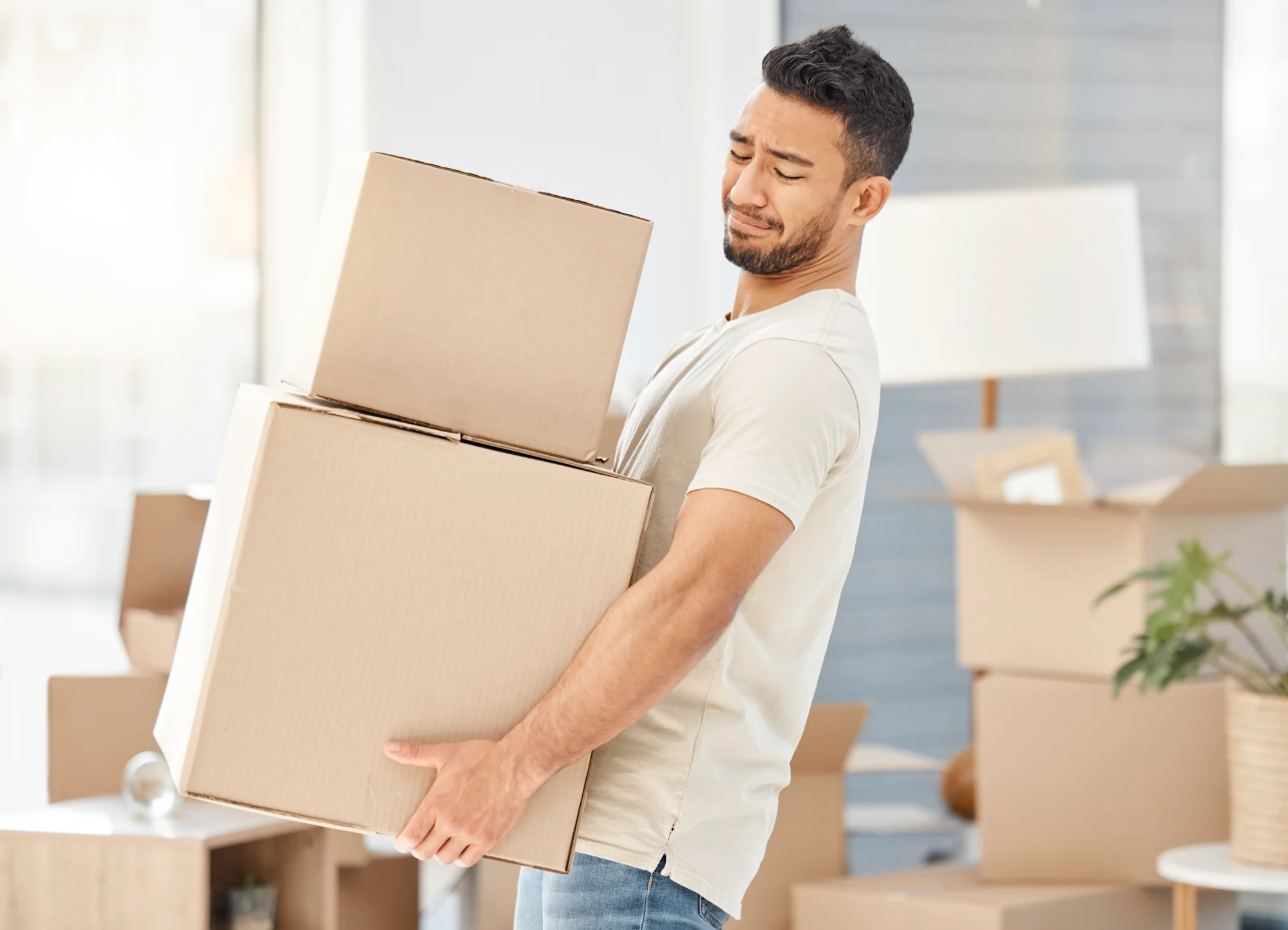 Person lifting box with a rotator cuff tear